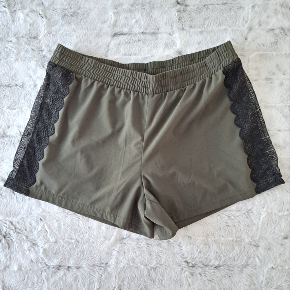 Fabletics running sport lined lace olive green shorts.  Size S.